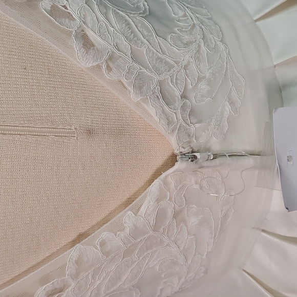 Wedding dress, David's Bridal, NWT. Size 6. Ivory lace and satin. Low V back. - Picture 9 of 16